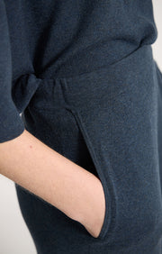 Person wearing Axela cropped trouser knitted in fine cotton in colour Indigo.