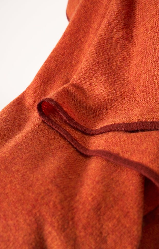 Daya cashmere knitted throw in colour Fire.