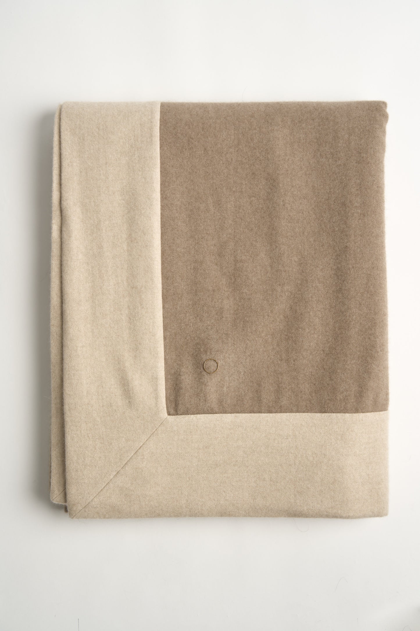 A flat lay image of the ETRA Big Bedspread in Taupe & Beige
