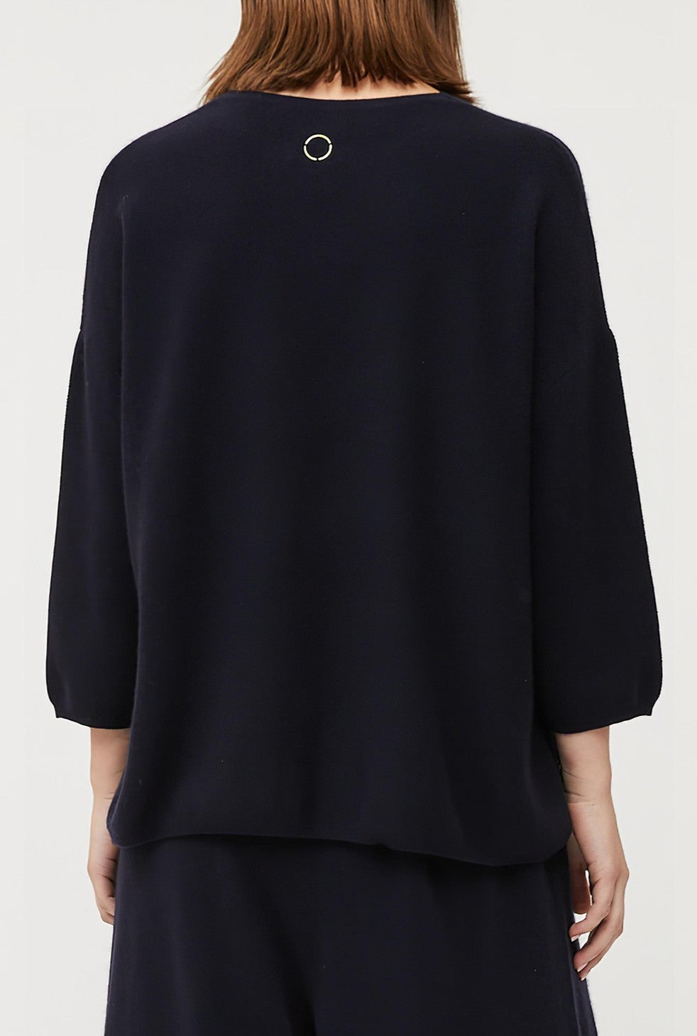 This image features the Gabi Sweater, a wardrobe staple known for its comfort and style. The sweater is displayed on a female model, showcasing its boxy fit and textured stitch detailing.