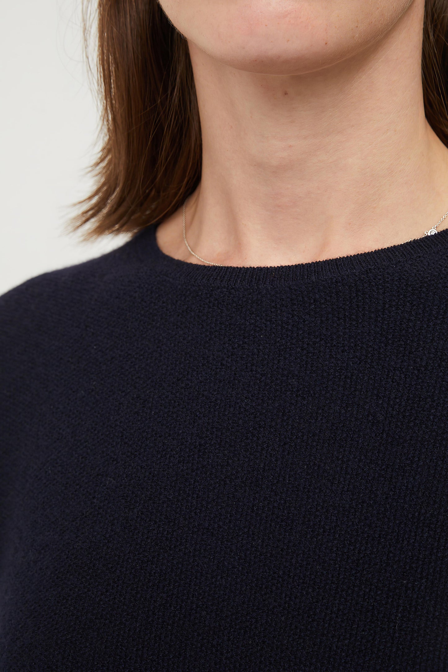 This image features the Gabi Sweater, a wardrobe staple known for its comfort and style. The sweater is displayed on a female model, showcasing its boxy fit and textured stitch detailing.