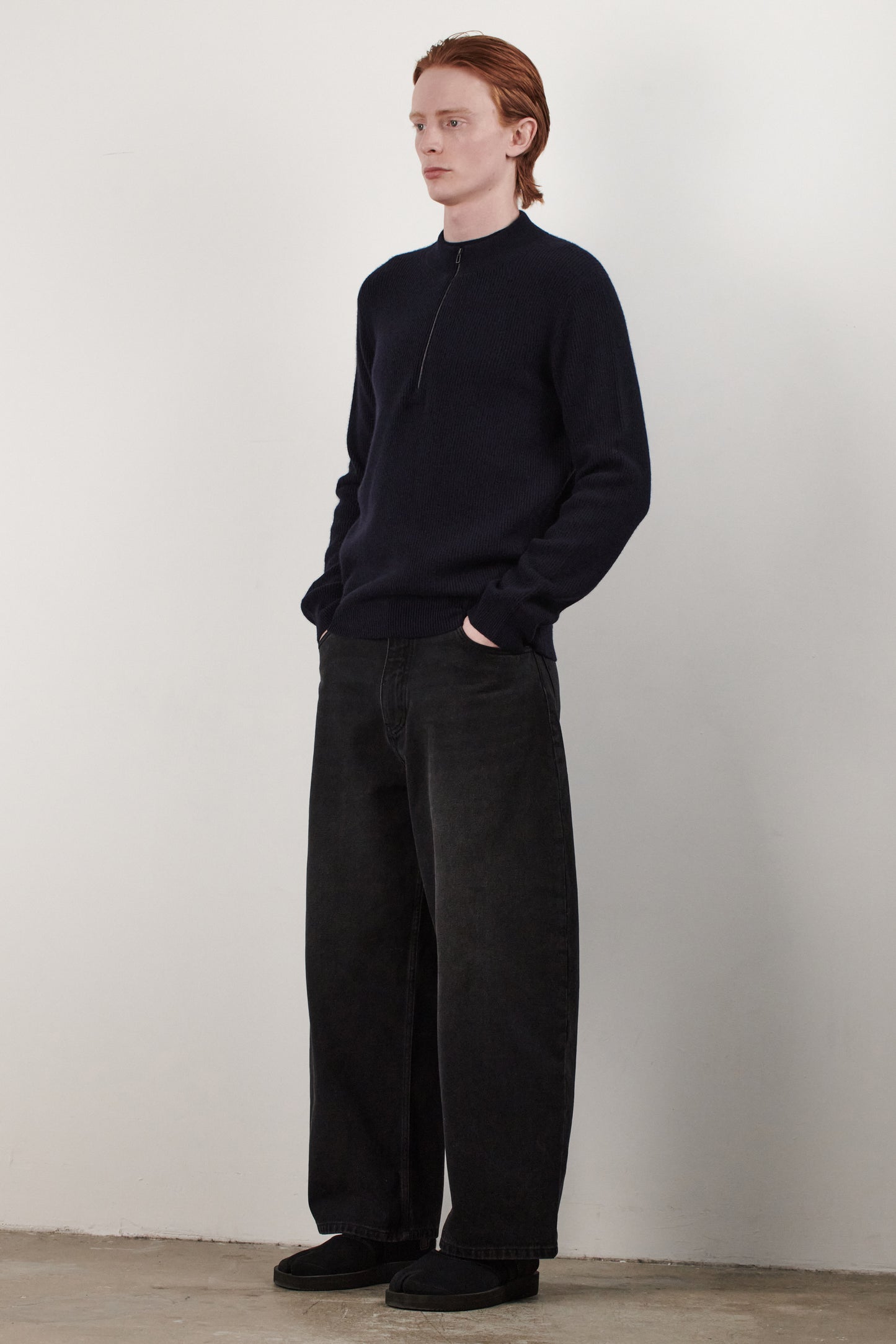 This image displays the Forte Sweater, a sophisticated and comfortable garment crafted from 100% cashmere. The sweater features a ribbed texture and a high neck, providing a chic and cozy appearance.