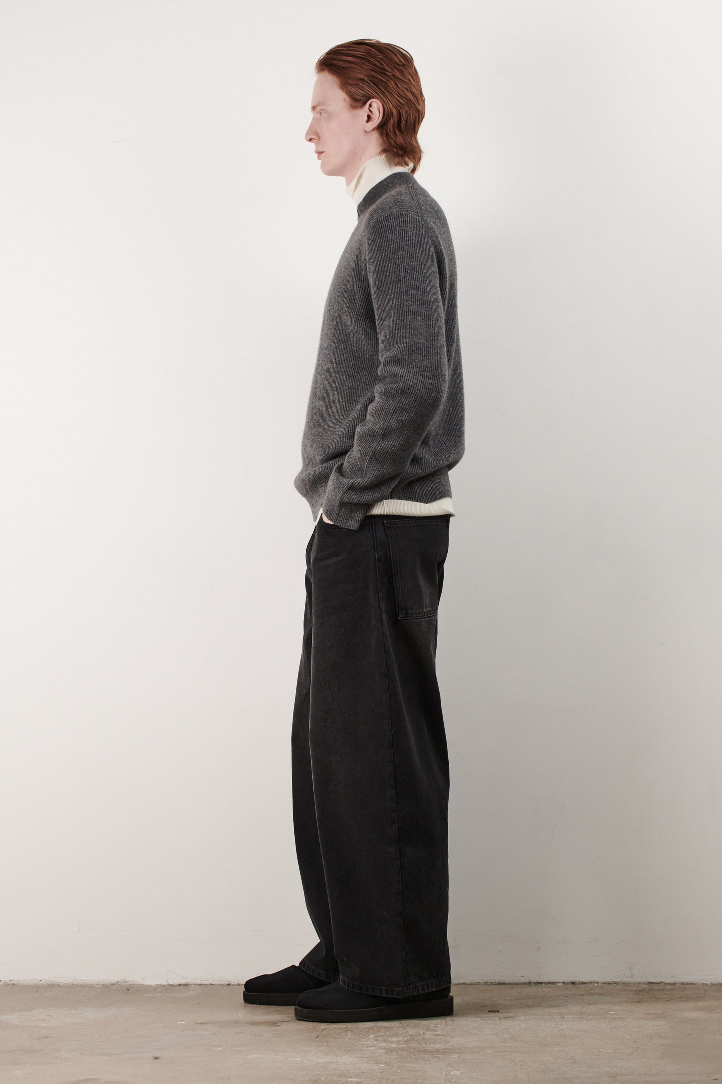 This image displays the Forte Sweater, a sophisticated and comfortable garment crafted from 100% cashmere. The sweater features a ribbed texture and a high neck, providing a chic and cozy appearance.