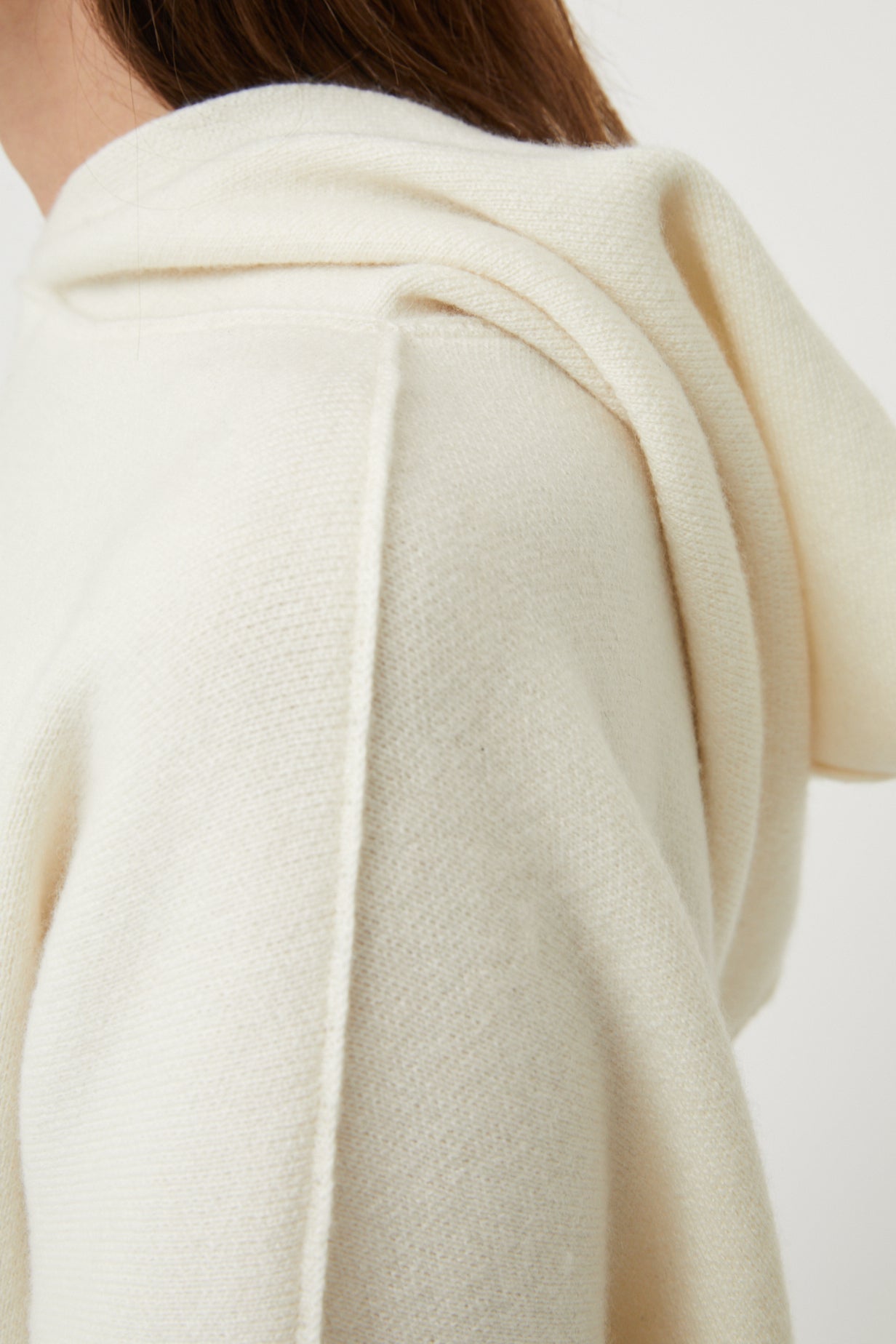 a close up of the Seku ivory hoodie shoulder and hood. Showing stitch detail