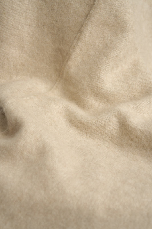 A closeup of the soft Silence throw in beige