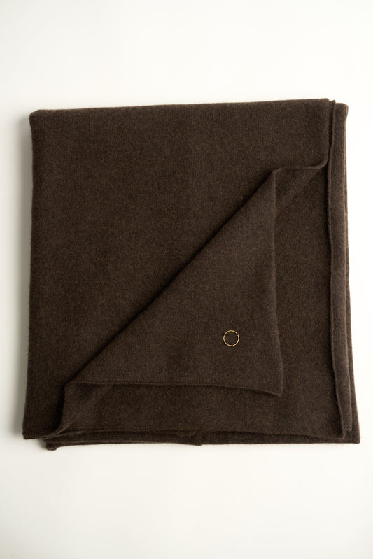 A flat lay image of a chocolate Silence throw