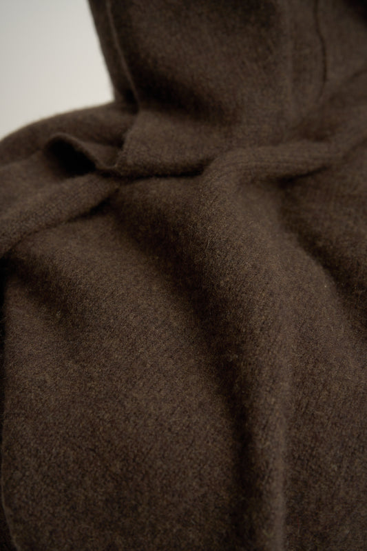 A closeup of the chocolate Silence throw