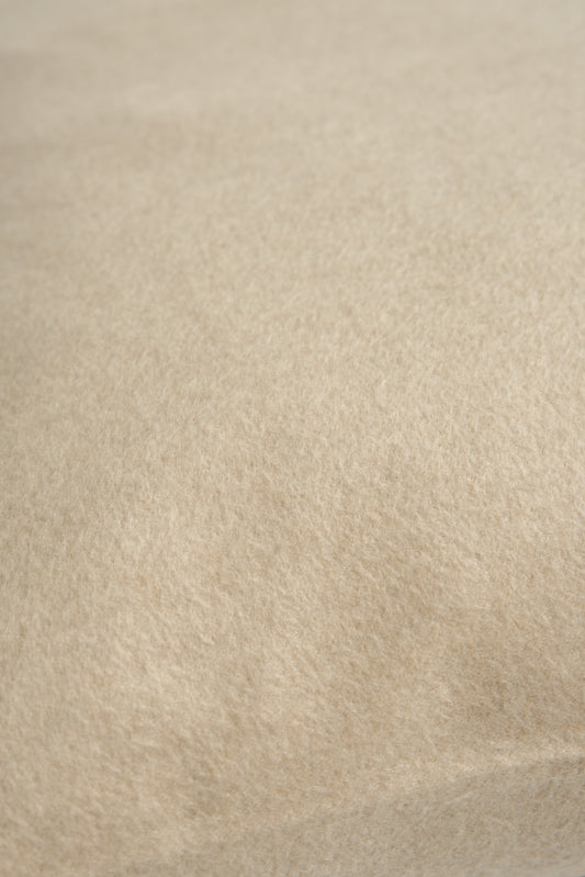 This image displays the Uno Cushion Cover, emphasizing its design and elegance. The cushion cover is showcased on a uniquely designed chair, highlighting its fit and presentation.