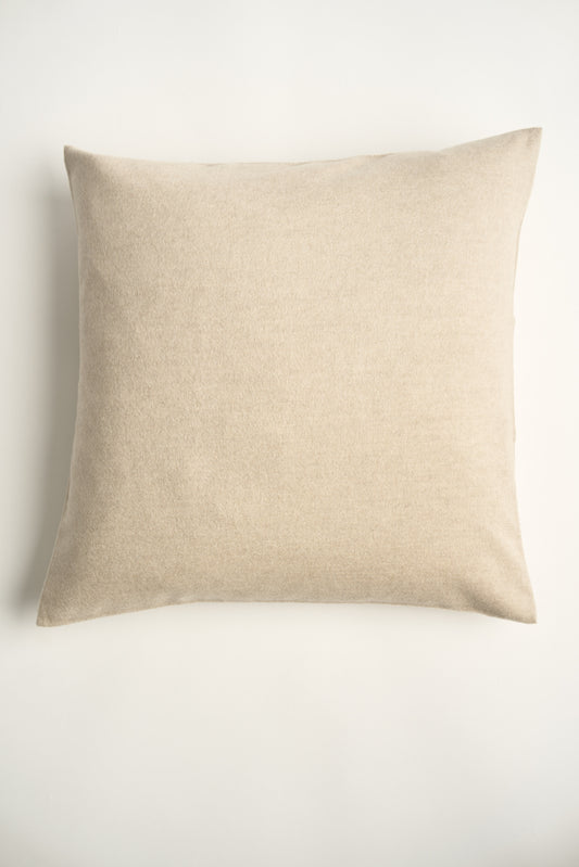 This image displays the Uno Cushion Cover, emphasizing its design and elegance. The cushion cover is showcased on a uniquely designed chair, highlighting its fit and presentation.