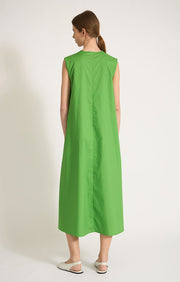 Woman wearing Altai woven a-line v-neck maxi dress made from cotton in colour Green.