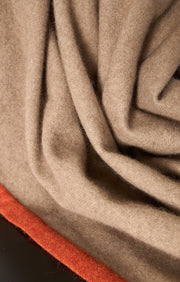 Arteno cashmere woven throw in colour Taupe with a coloured border in Fire.