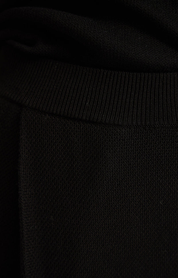 woman wearing Cara Cotton Trousers in Black