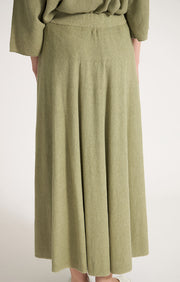 Woman wearing Catang cotton midi skirt in colour Fern.