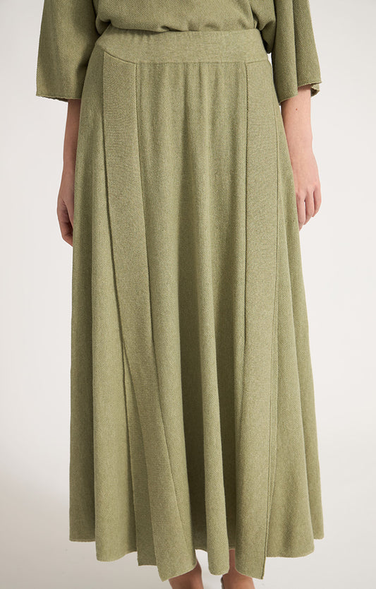 Woman wearing Catang cotton midi skirt in colour Fern.