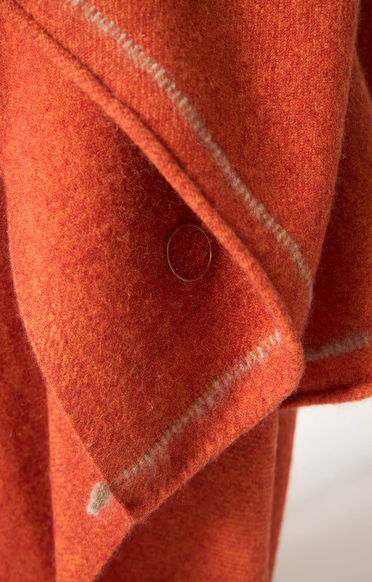 Sabra cashmere woven throw in colour Fire. 