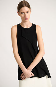 Woman wearing Sinca sleeveless cotton top in colour Black. 