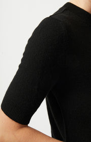 Woman wearing Brista high crew neck cashmere top in colour Black. 
