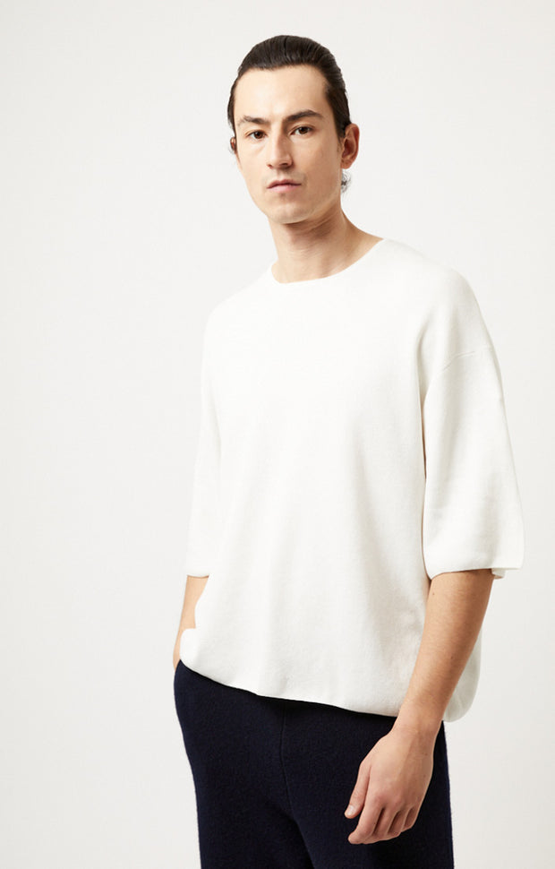 Person wearing Lyn fine cotton top in colour Ivory.