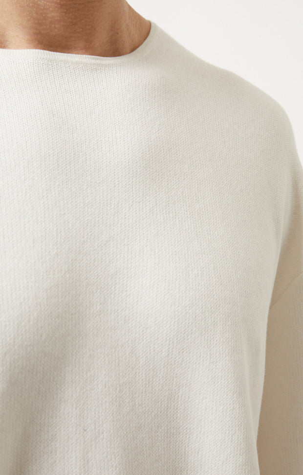 Person wearing Lyn fine cotton top in colour Ivory.